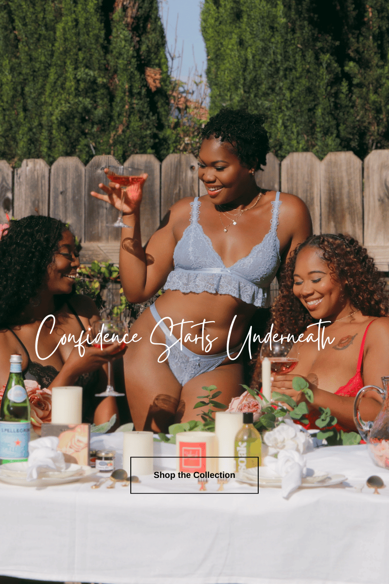 Three women at an outdoor gathering wearing sexy lingerie with text overlay ‘Confidence Starts Underneath’ and ‘Shop the Collection’ – Shush Lingerie femininity and nature campaign 